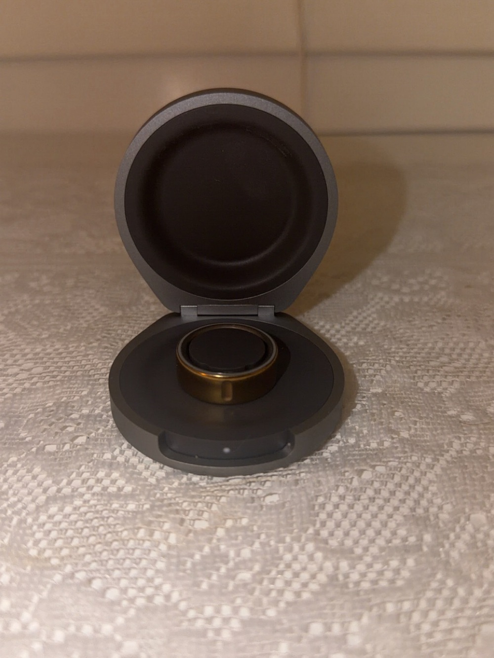 Oura Ring in Gold with Gray Charging Case